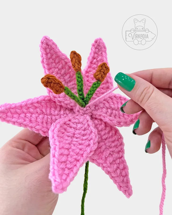 free crochet lily pattern tutorial of how to sew the stamens into the petals