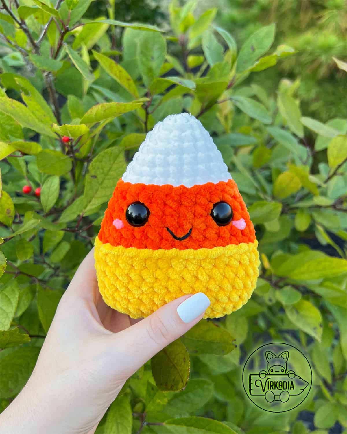 free crochet candy corn amigurumi softie in chunky yarn for DIY Halloween decor, fall decoration, and handmade gifts