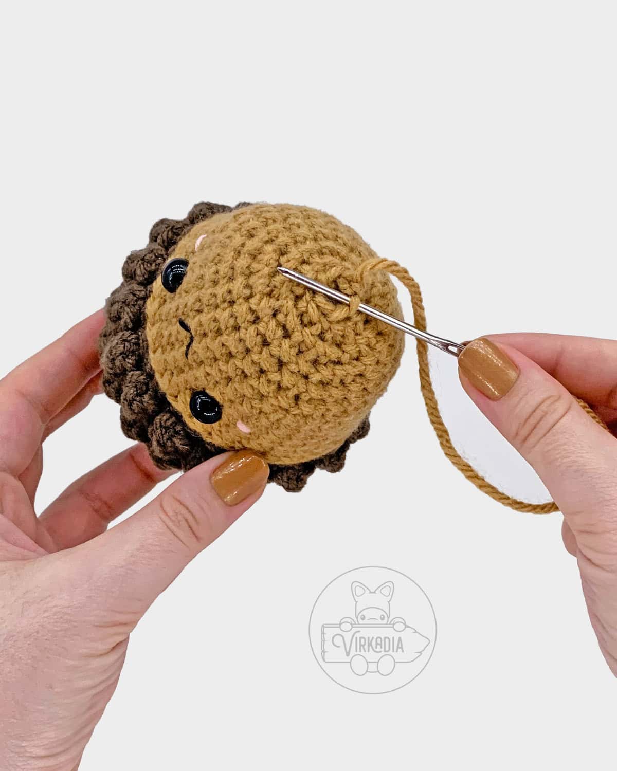 free crochet acorn amigurumi pattern tutorial of how to sew the bottom of the nut closed