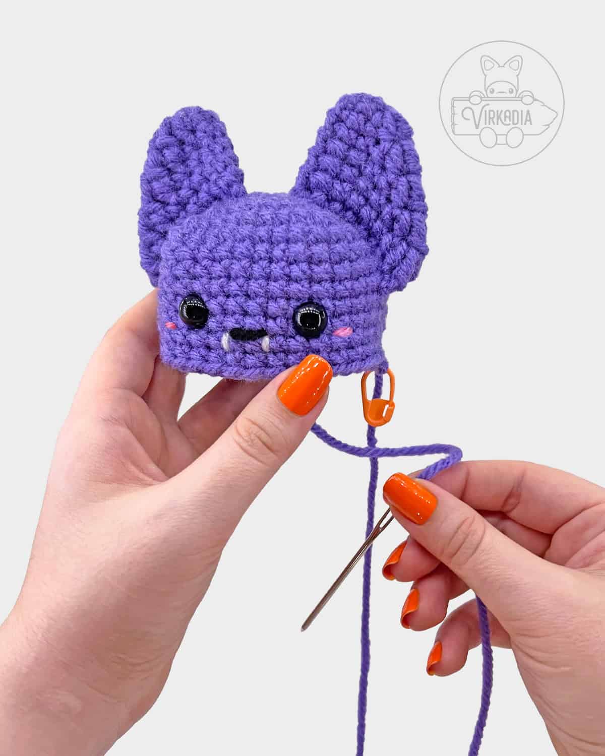 free crochet bat amigurumi pattern tutorial of how to attach the ears