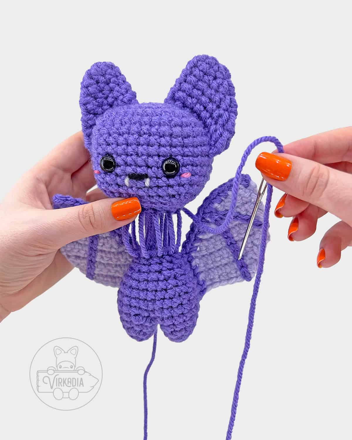 free crochet bat amigurumi pattern tutorial of how to attach the head