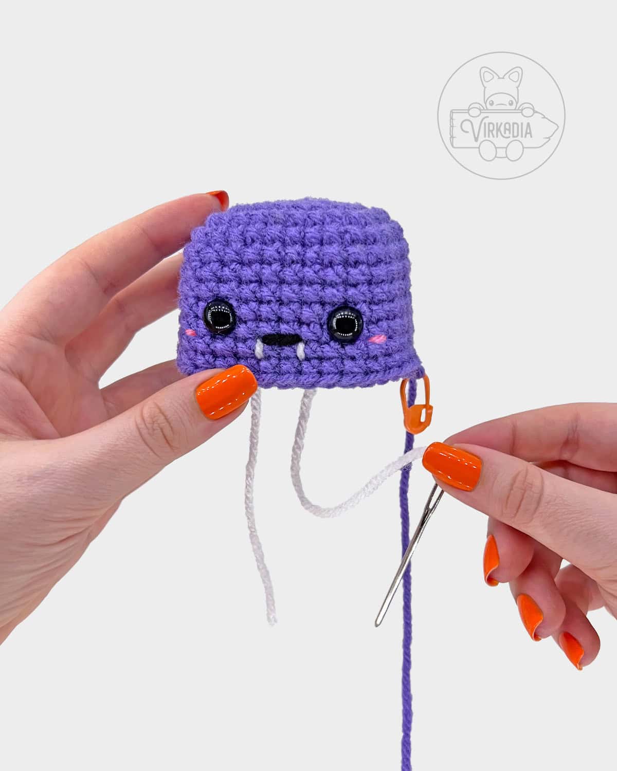 free crochet bat amigurumi pattern tutorial of how to embroider a mouth with fangs