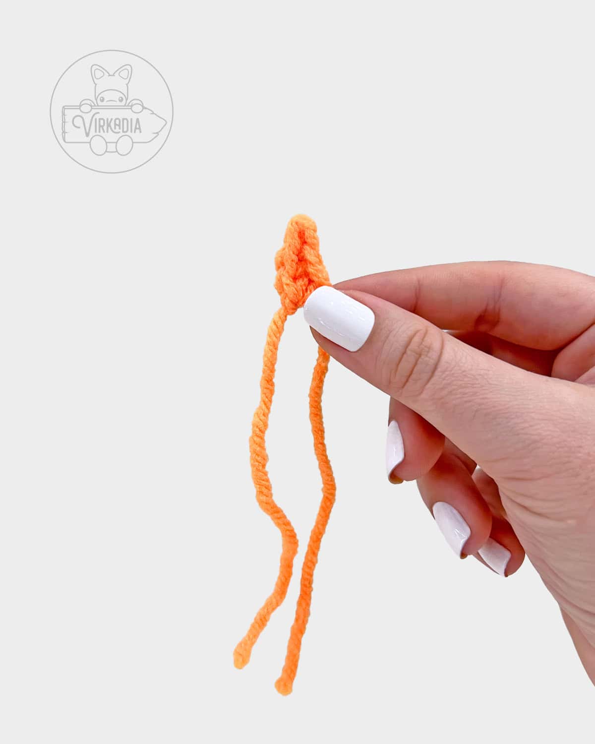free amigurumi pattern tutorial of how the flame should look before adding the wick