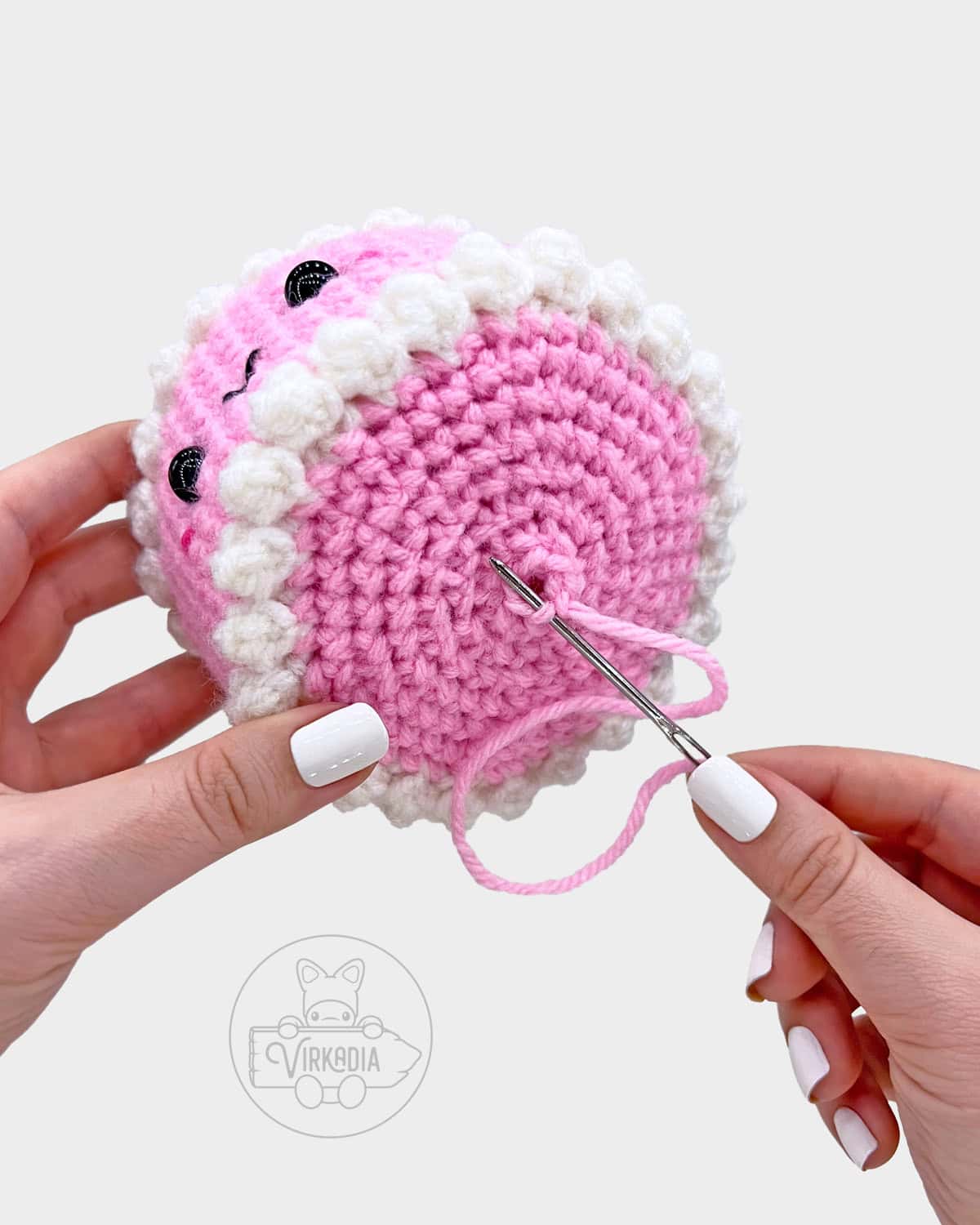 free crochet birthday cake amigurumi pattern tutorial of how to sew the bottom of the dessert closed
