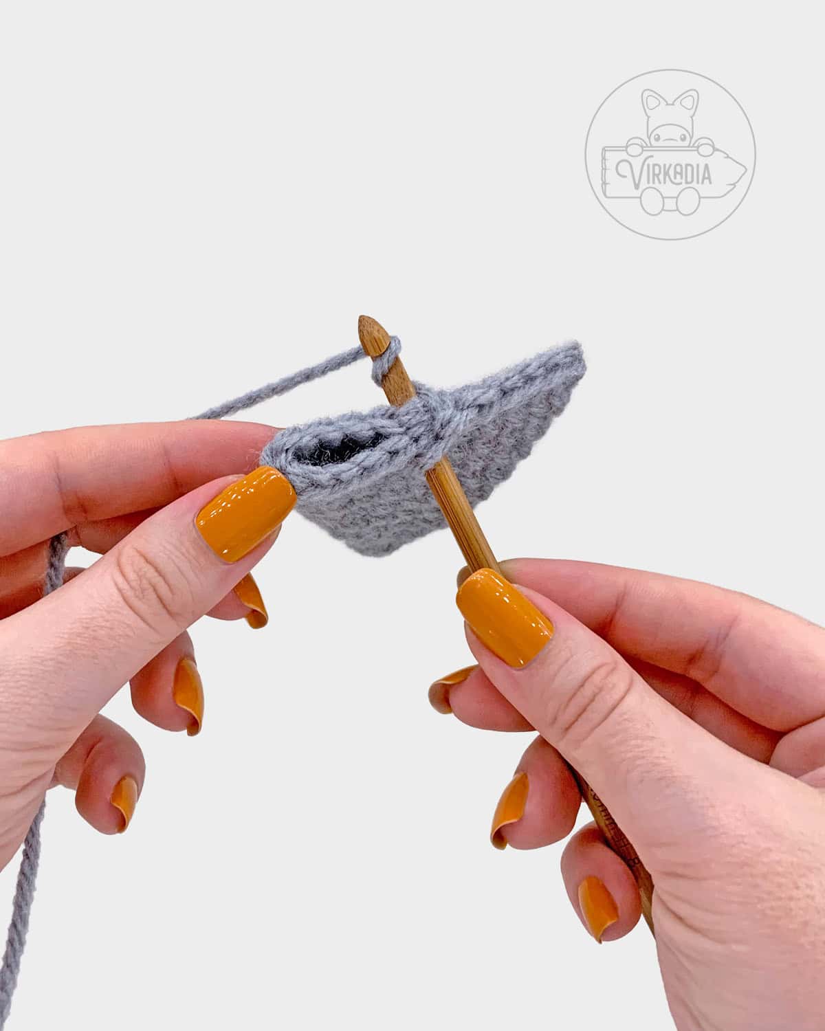 free amigurumi pattern tutorial of how to fold the ear and work through both layers