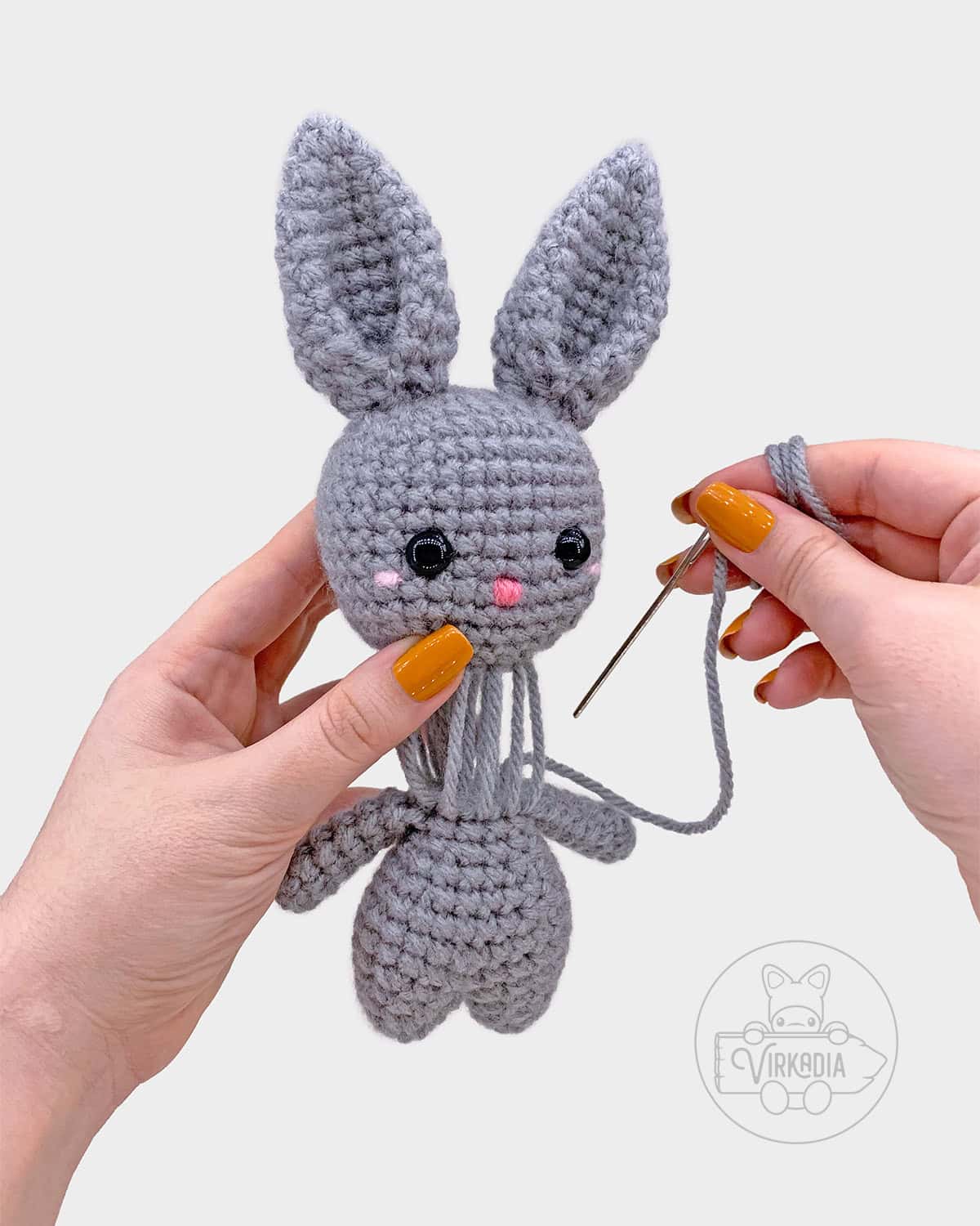 free crochet bunny amigurumi pattern tutorial of how to sew the head onto the body