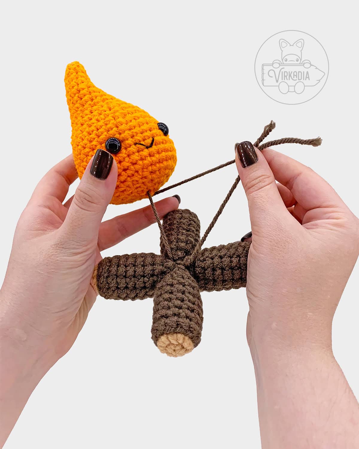 free crochet campfire amigurumi tutorial of how to sew the logs and flame together