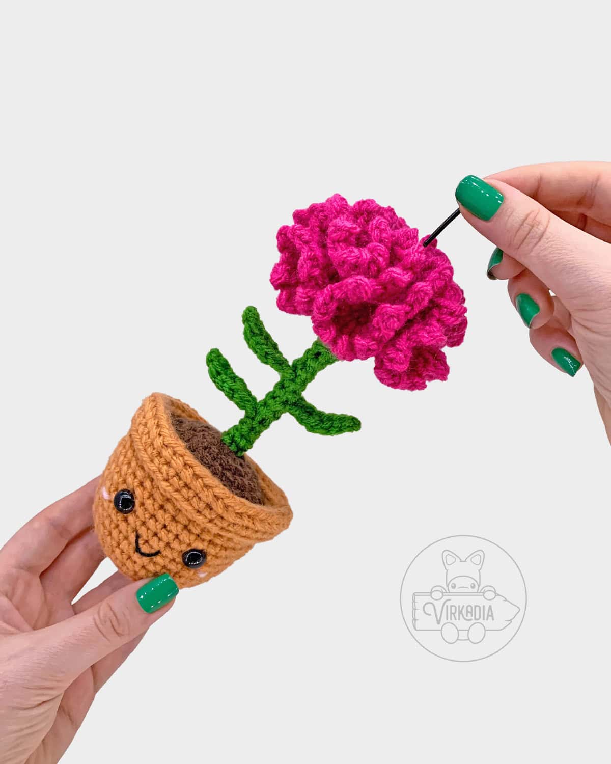free crochet carnation amigurumi pattern tutorial demonstration of how to add the wire into the flower