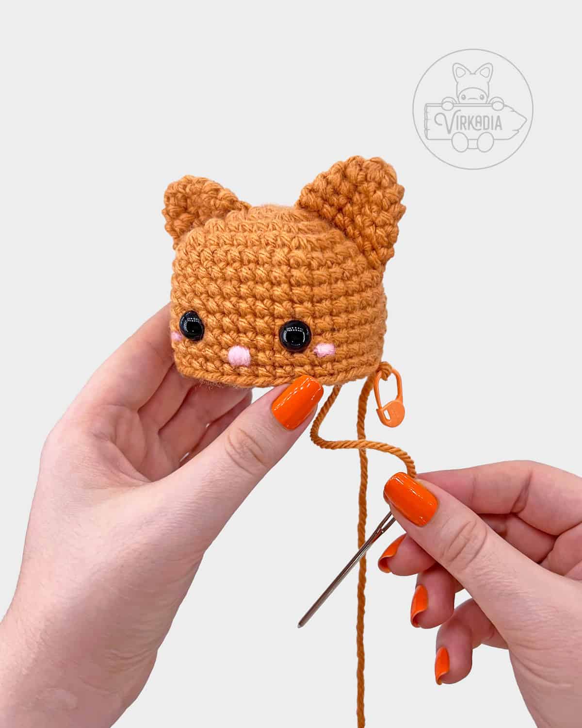 free crochet cat amigurumi pattern tutorial of how to attach the ears