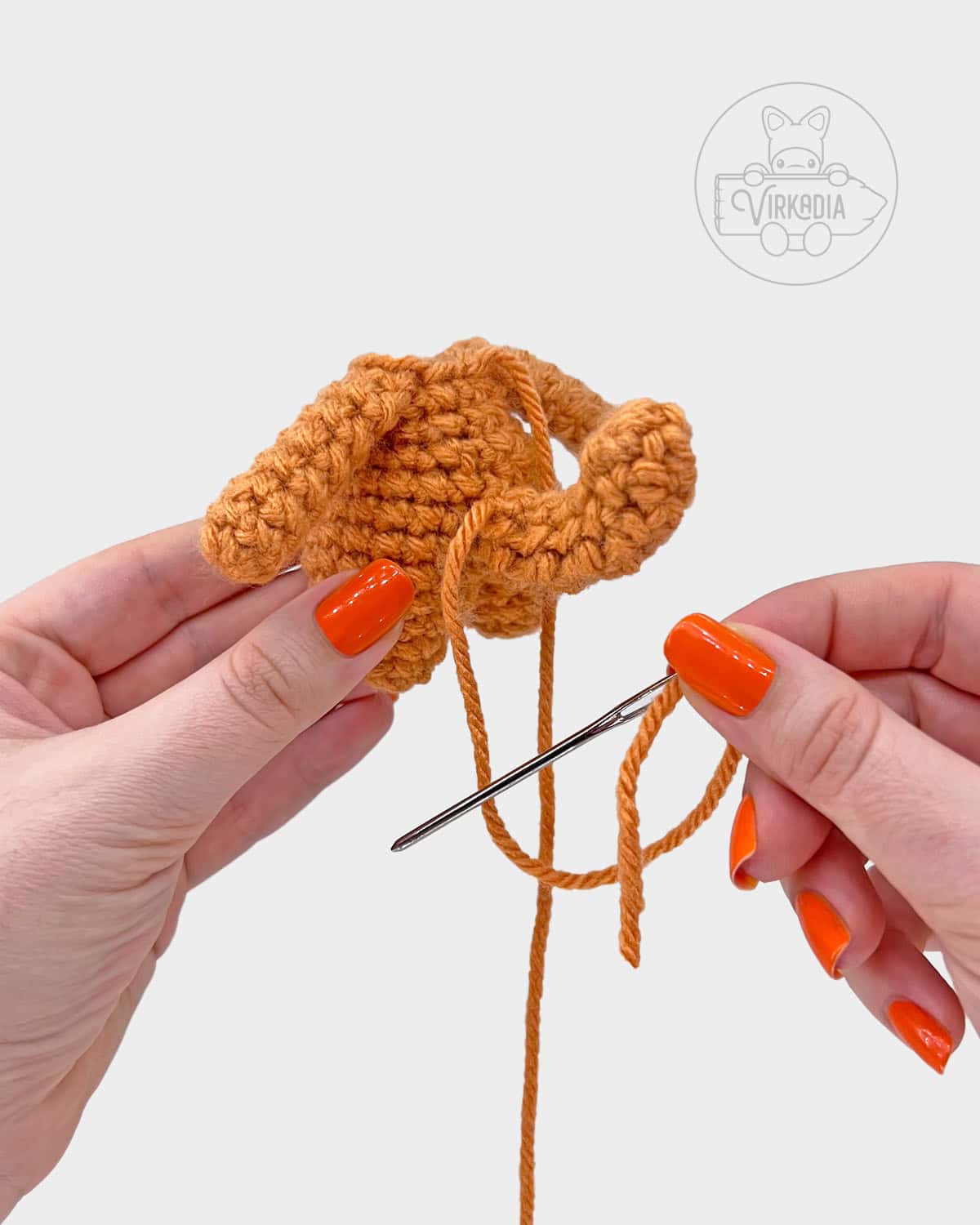free crochet cat amigurumi pattern tutorial of how to attach the tail
