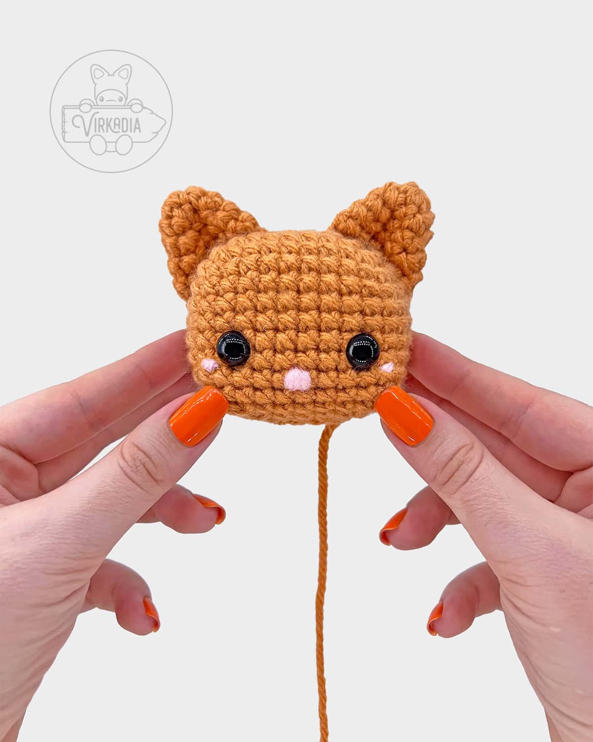 free crochet cat amigurumi pattern tutorial of how the face should look