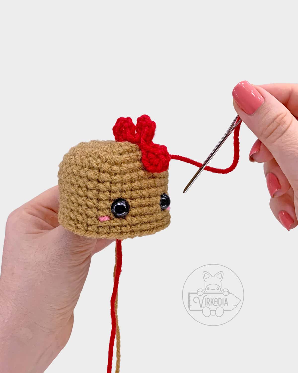 free crochet chicken amigurumi pattern tutorial of how to sew the comb onto the head