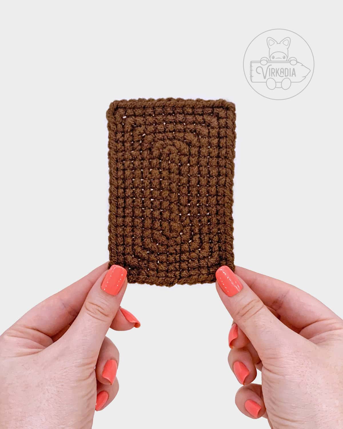free amigurumi pattern tutorial of how the large front piece should look before adding the smaller pieces