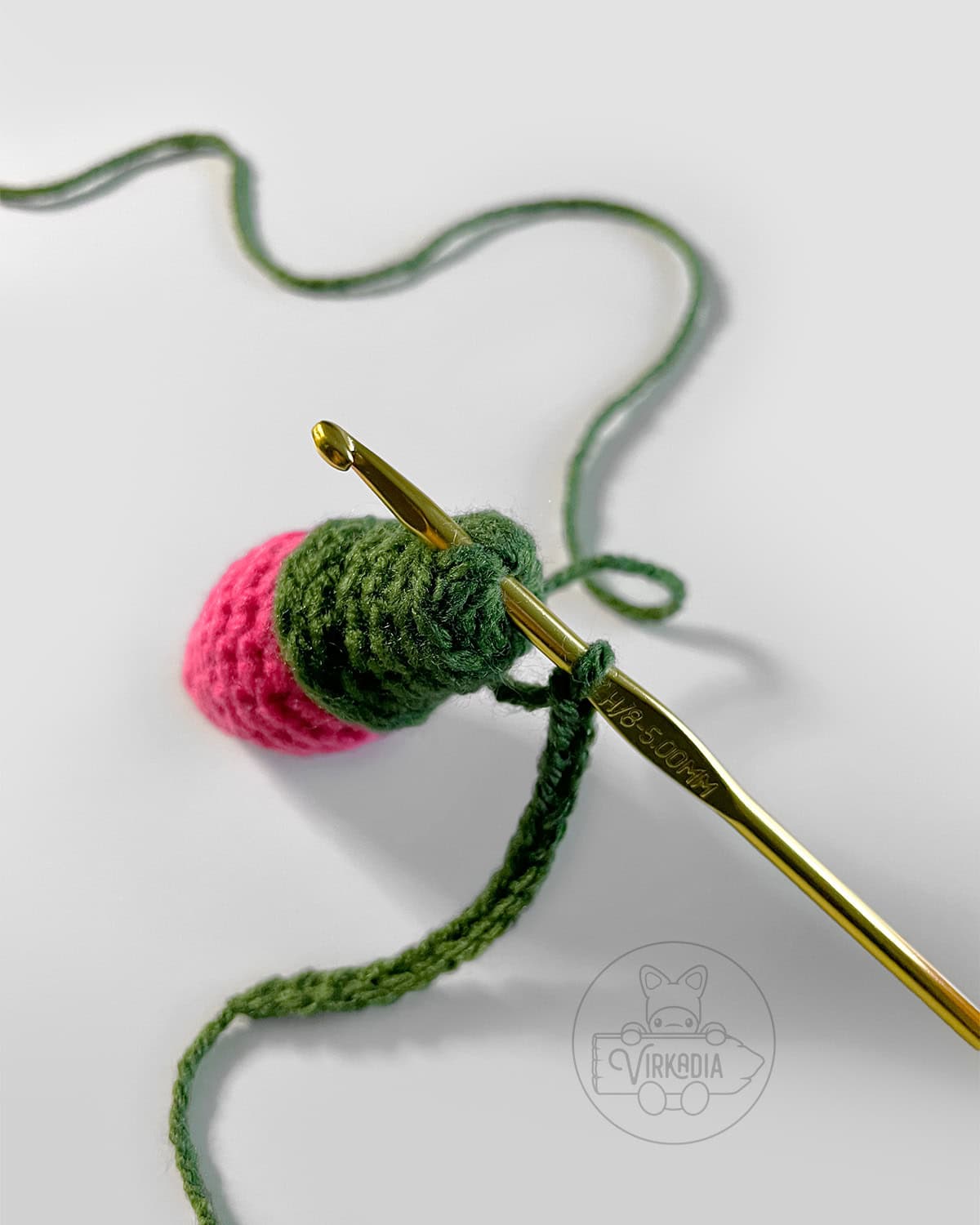 demonstration of where to insert hook into top of bulb to attach