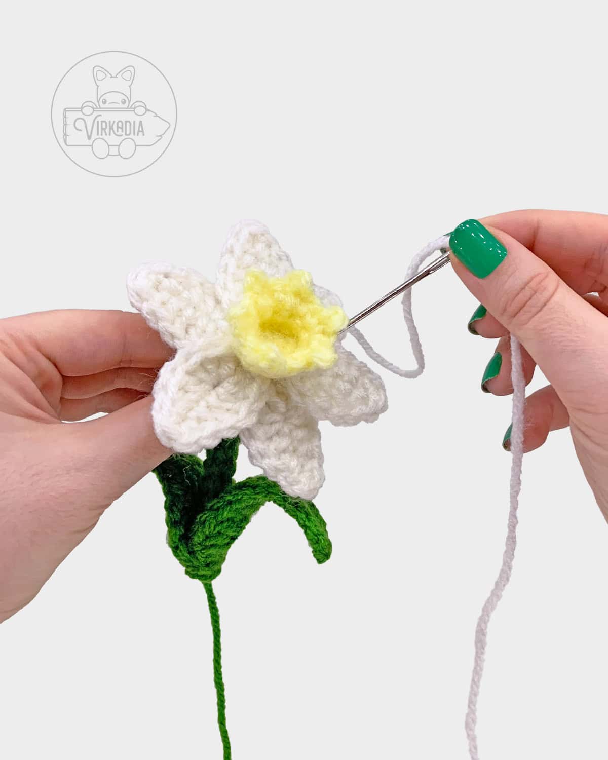 free crochet daffodil amigurumi pattern tutorial demonstration of how to sew the petals