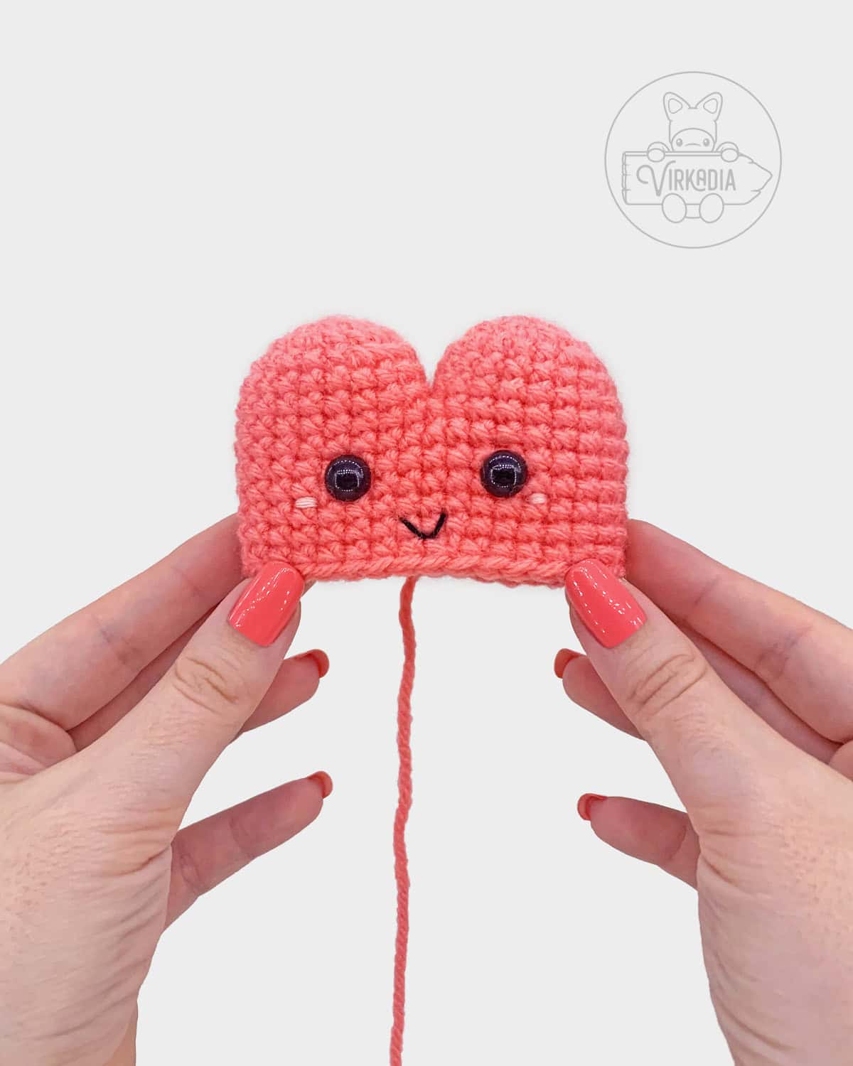 free crochet heart amigurumi pattern tutorial of where the face should be embroidered