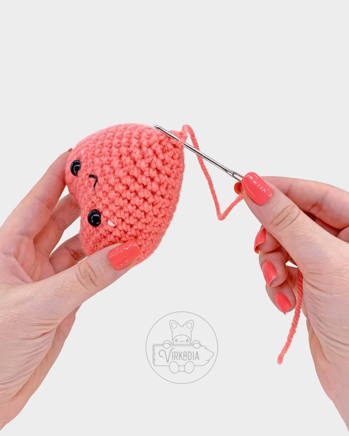 free crochet heart amigurumi pattern tutorial of how to sew the bottom hole closed