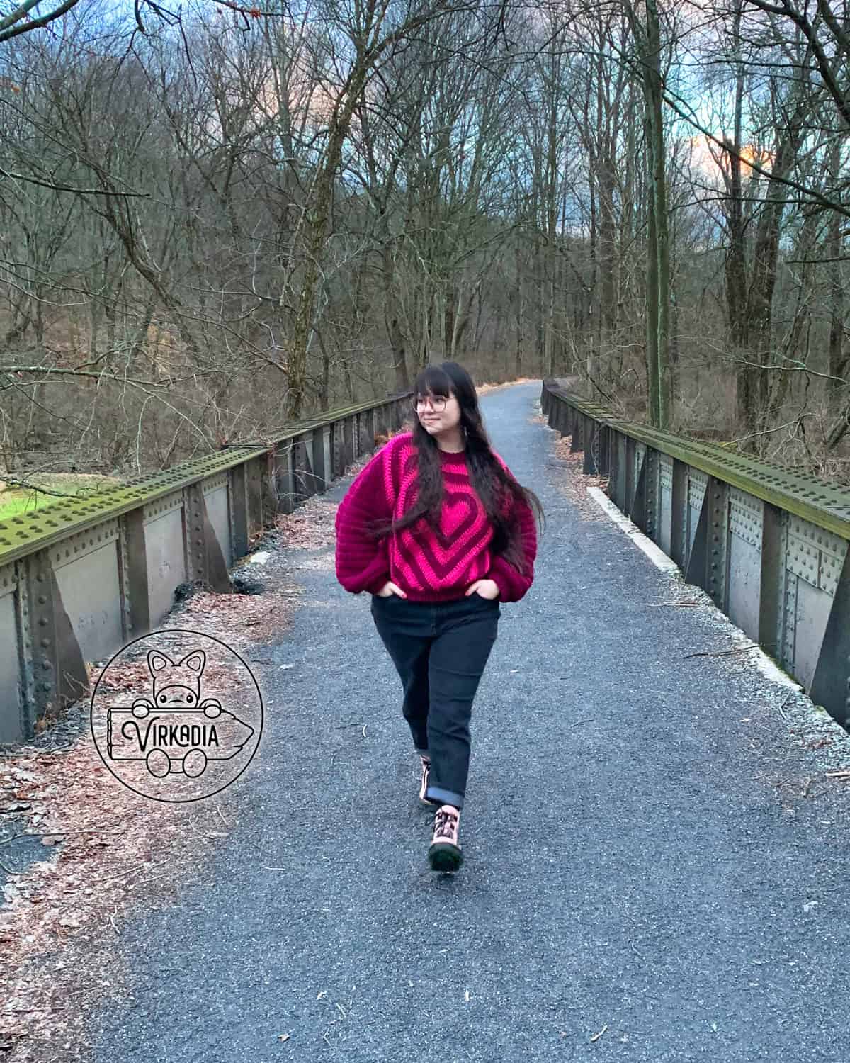 free crochet heart sweater pattern photographed while walking for Valentine's Day, romantic gifts, and holiday clothing