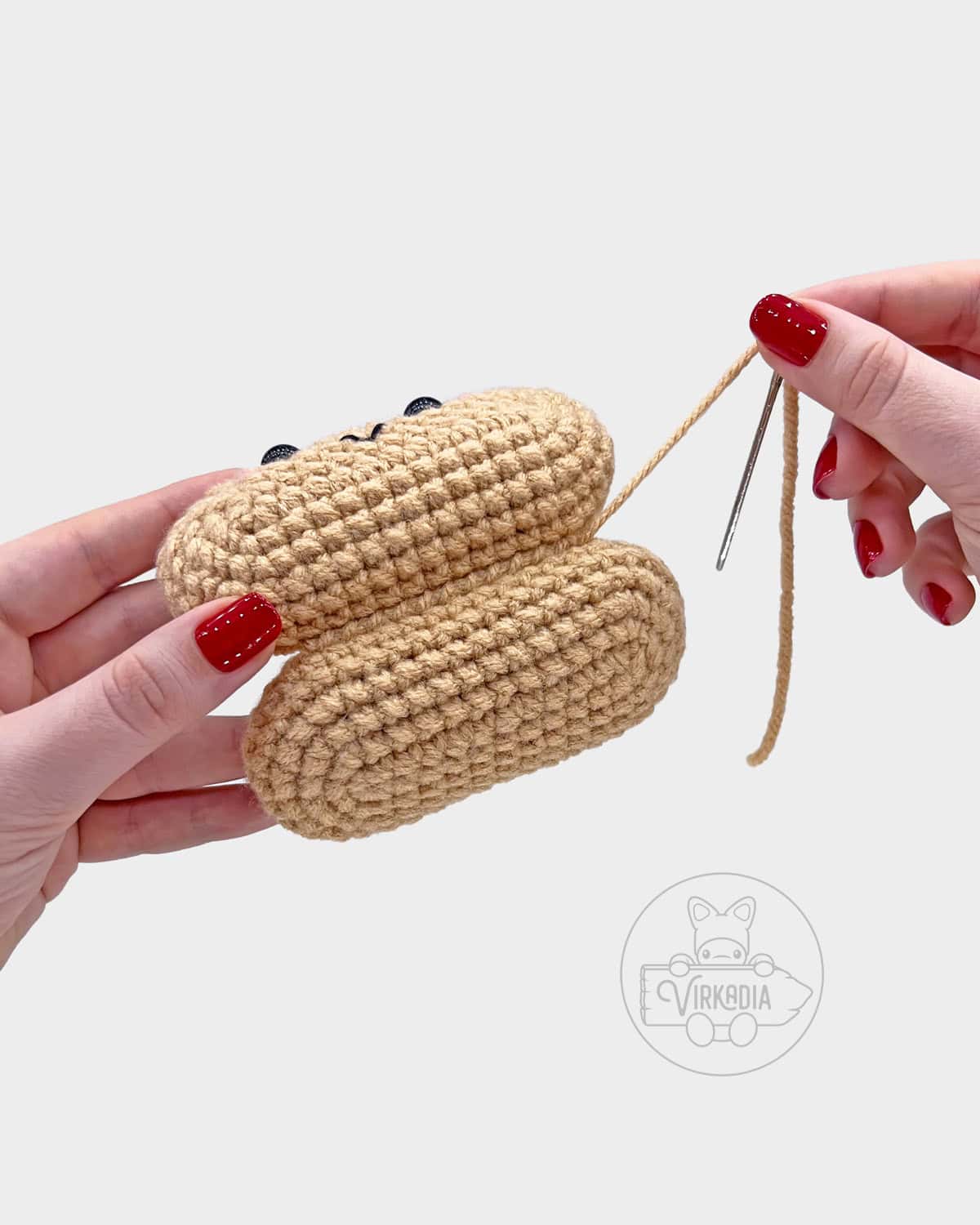 free crochet hot dog amigurumi pattern tutorial of how to sew the buns together into one roll