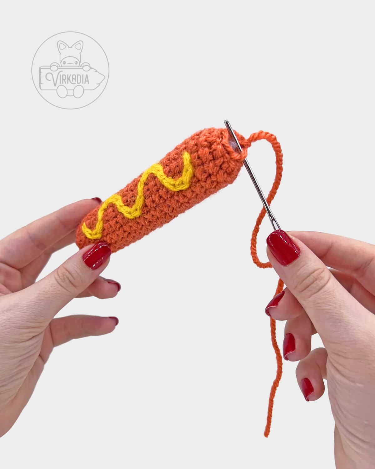 free crochet hot dog amigurumi pattern tutorial of how to sew the meat closed