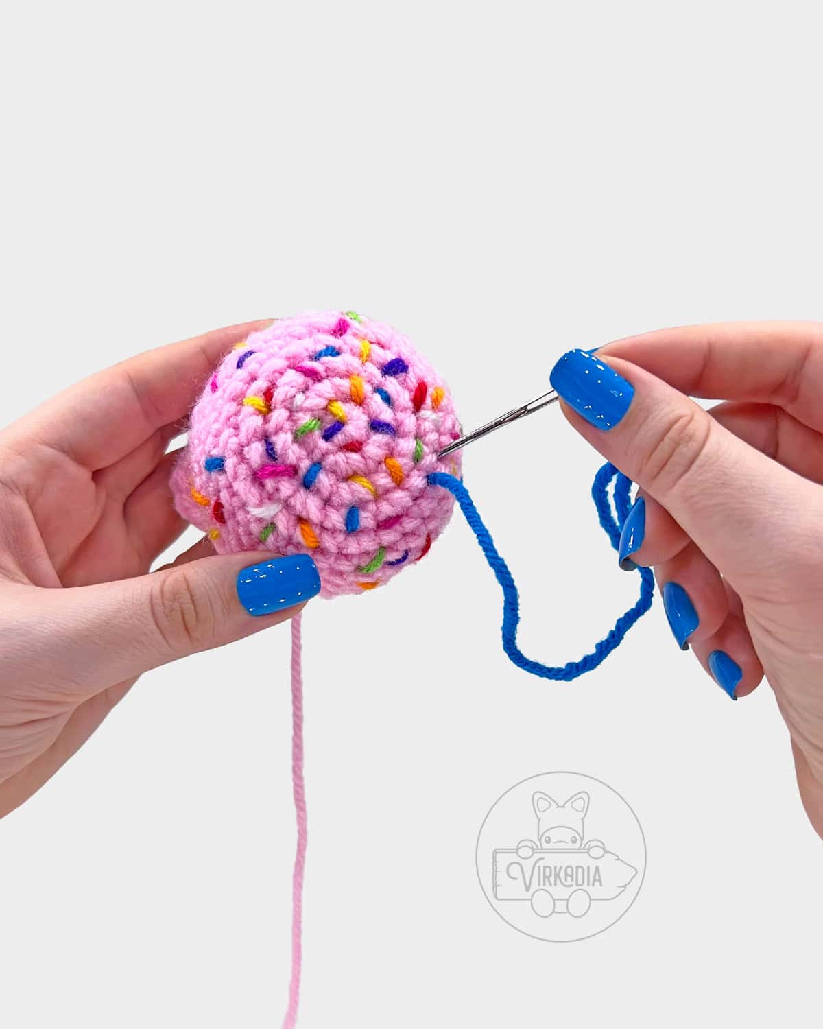 free amigurumi pattern tutorial of how to embroider the sprinkles on top of the scoop