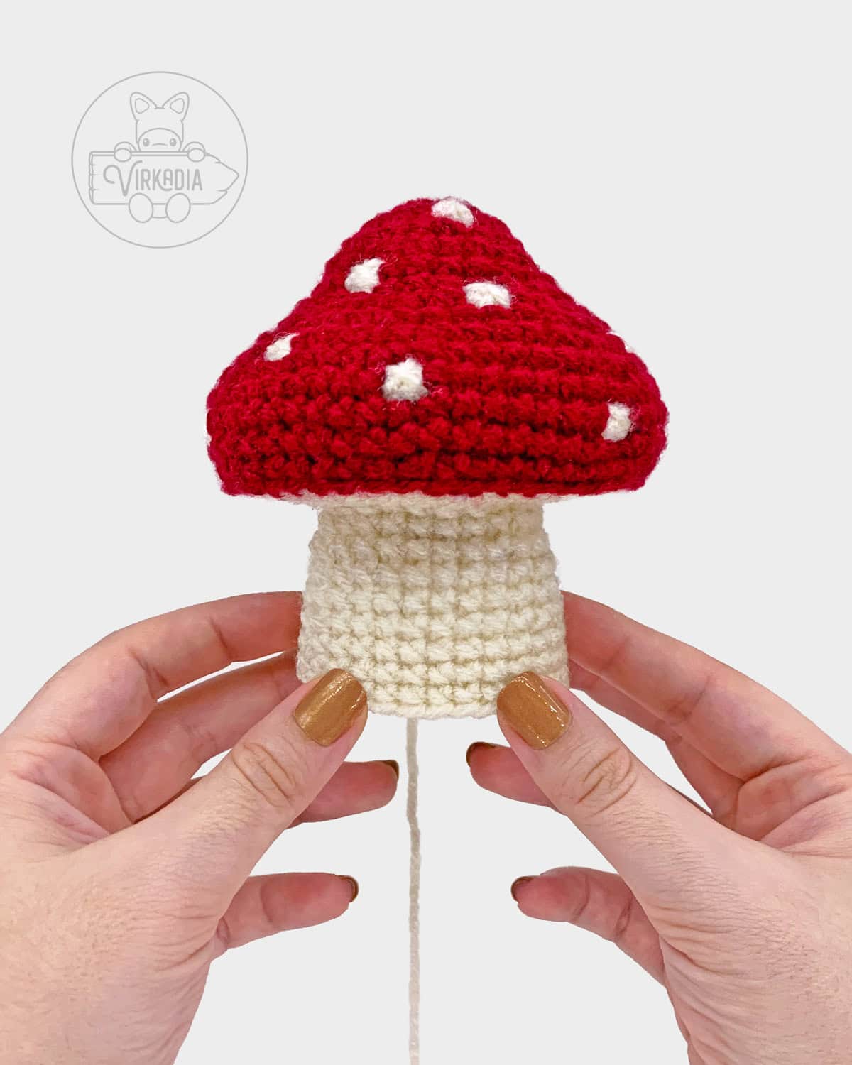 free crochet mushroom amigurumi pattern tutorial of how the stalk should look before the face