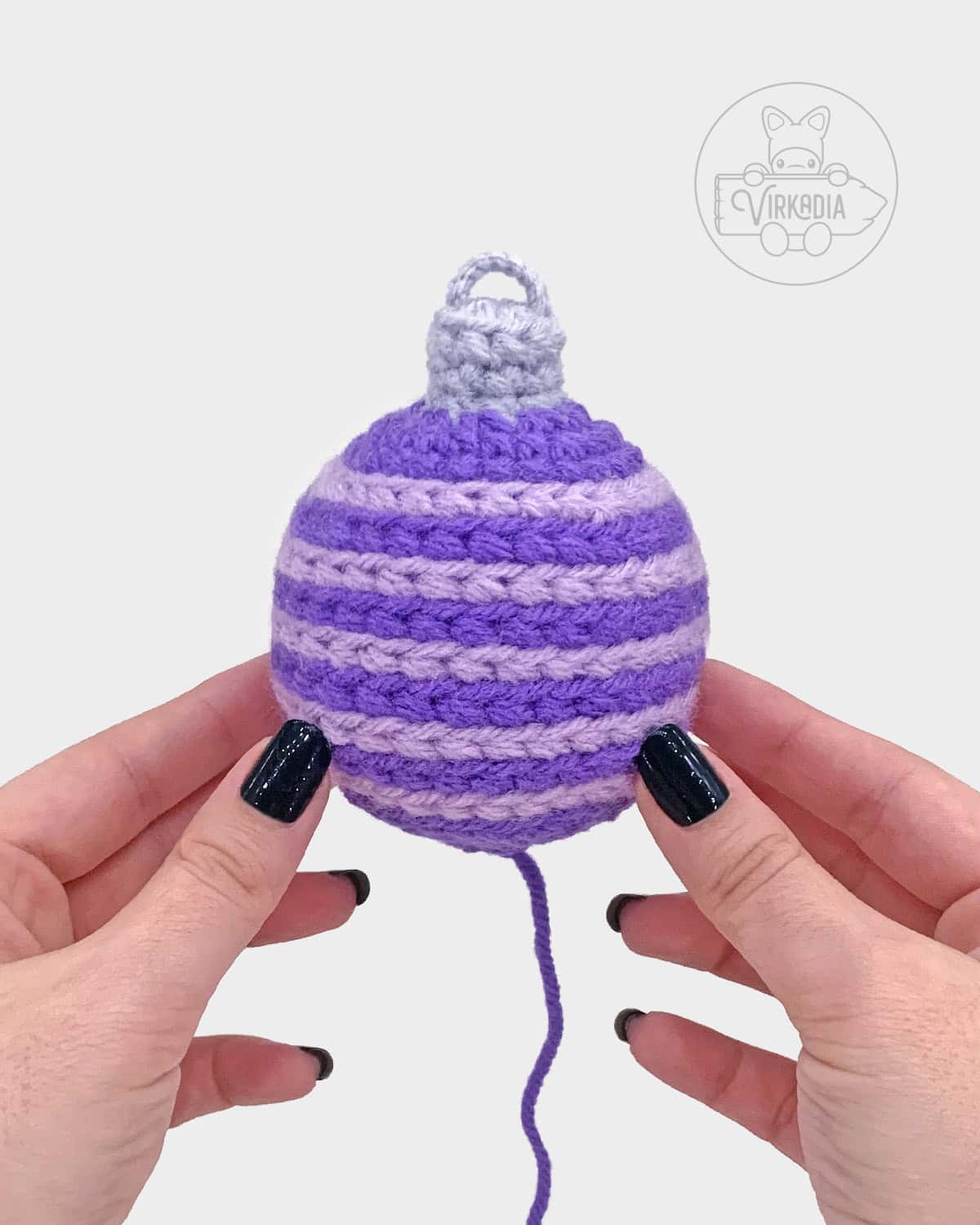 free crochet bauble ornament amigurumi pattern tutorial of what the horizontally striped ornament looks like