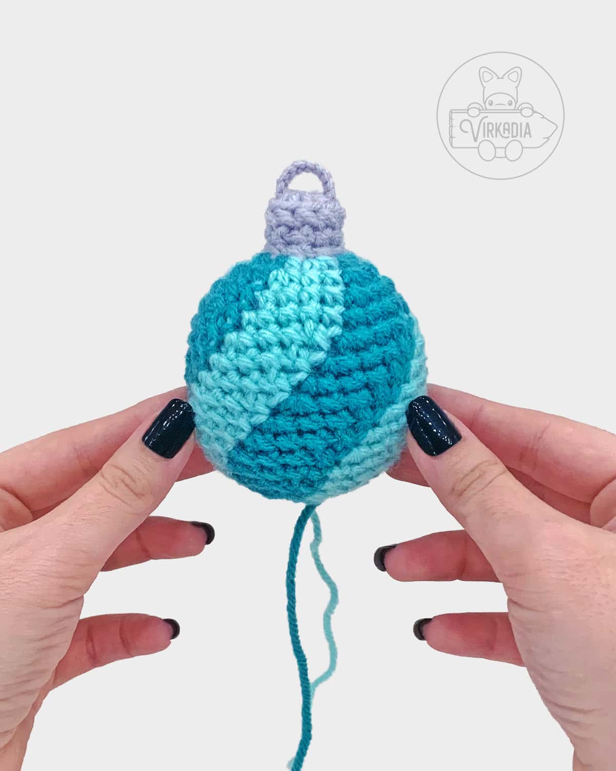 free crochet bauble ornament amigurumi pattern tutorial of what the spiral striped ornament looks like