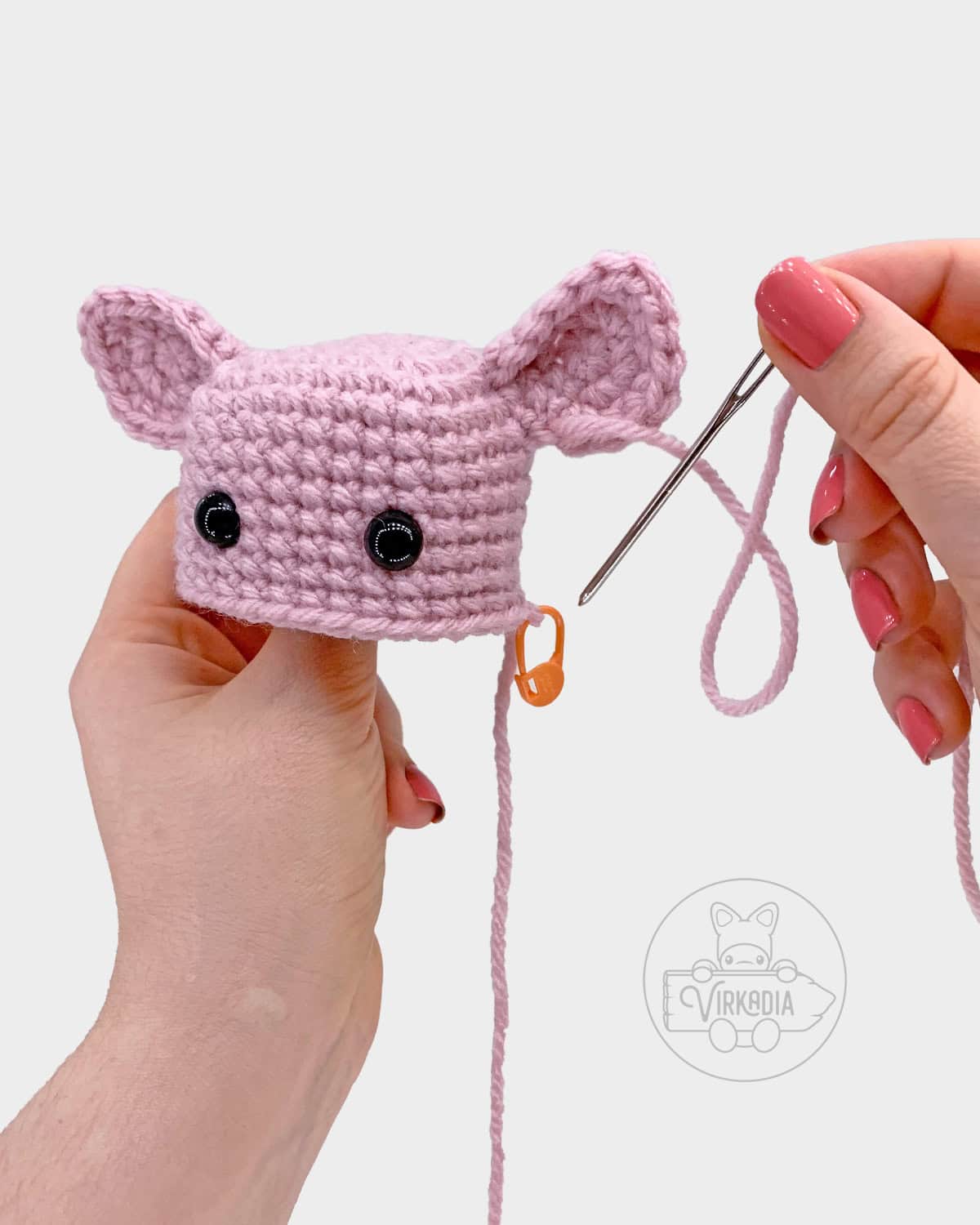 free amigurumi pattern tutorial of how to sew the ears onto the head