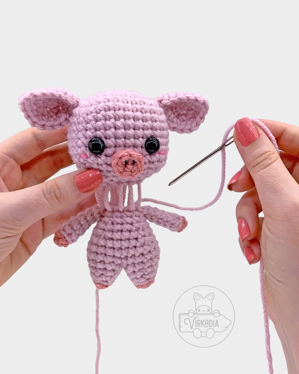 free crochet pig amigurumi pattern tutorial of how to sew the head onto the body