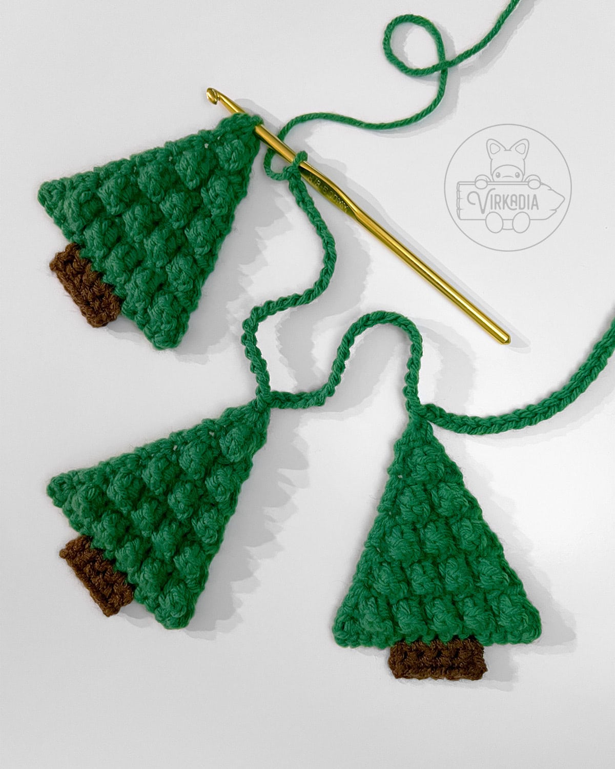 tutorial of how to attach your crochet pine tree garland motifs together for Christmas decorations, DIY holiday decor, and handmade gifts
