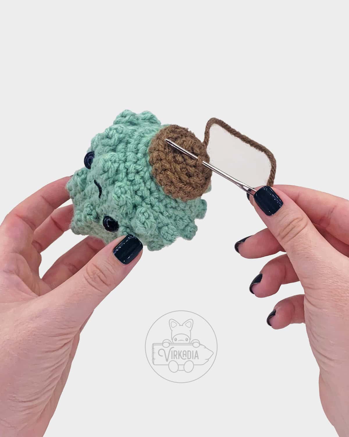 free crochet pine tree amigurumi pattern tutorial of how to sew the stump closed
