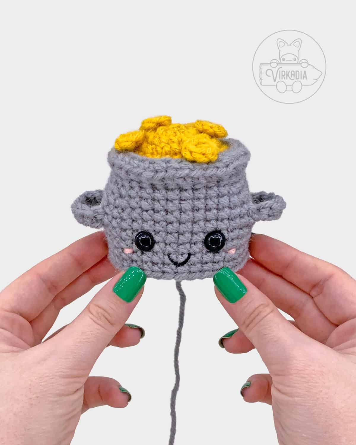 free crochet pot of gold amigurumi pattern tutorial of where the face should be embroidered
