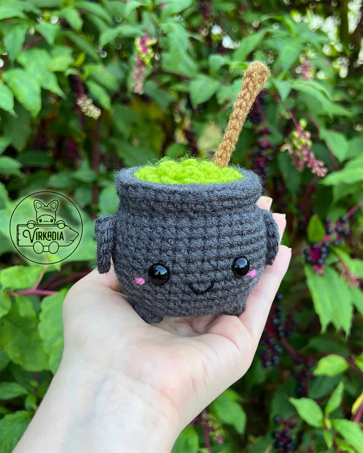candid shot of free crochet potion cauldron amigurumi plushie for Halloween decorations, spooky home decor, and fall crafts, and DIY gifts