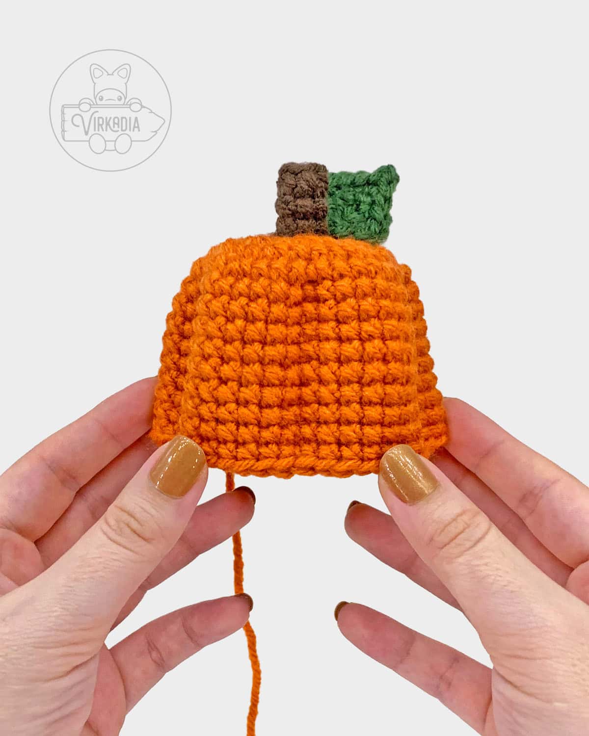 free crochet pumpkin amigurumi pattern tutorial of how it should look before the face
