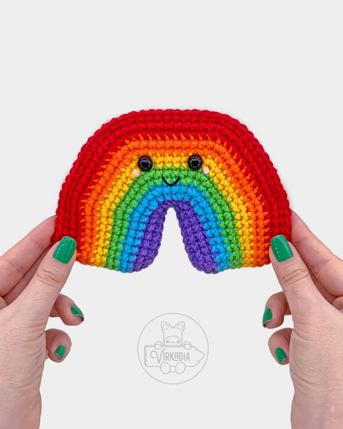 free crochet rainbow amigurumi pattern tutorial of where the face should be embroidered