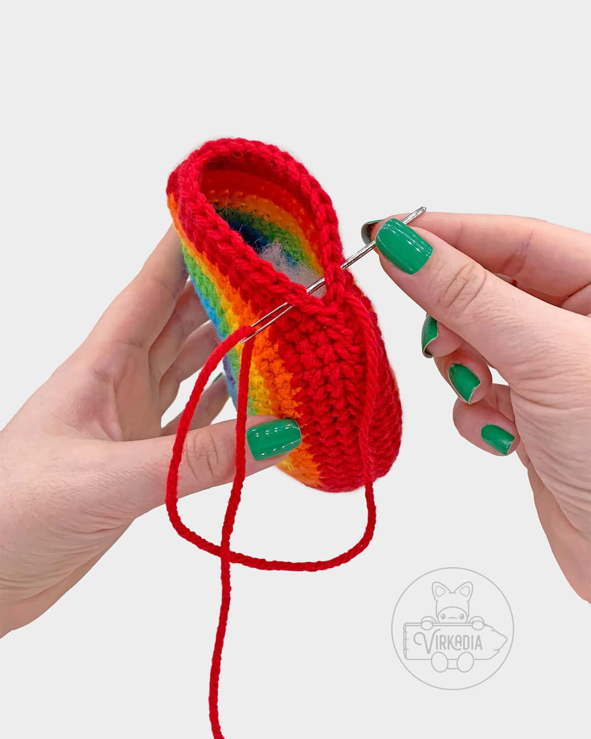 free crochet rainbow amigurumi pattern tutorial of how to sew the top seam closed