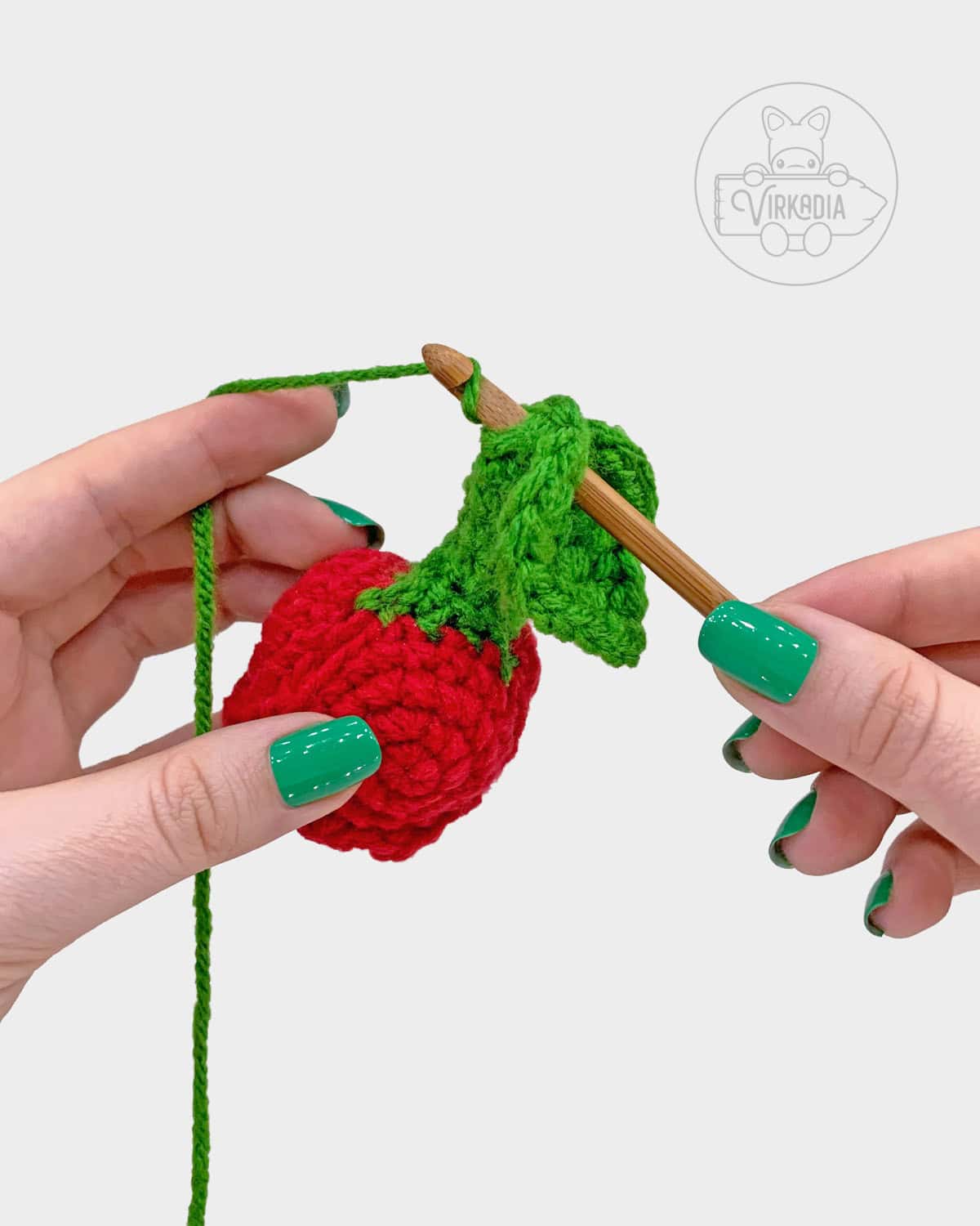 free crochet rose amigurumi pattern tutorial demonstration of how to attach the large leaves