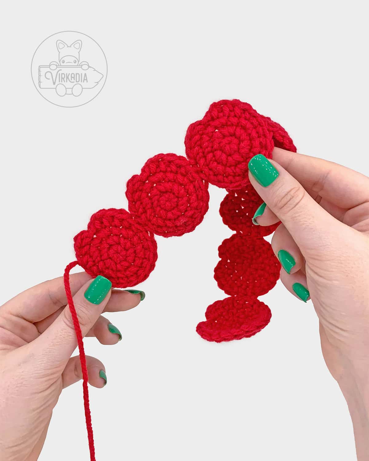 free crochet rose amigurumi pattern tutorial demonstration of how the petals should look after sewing together
