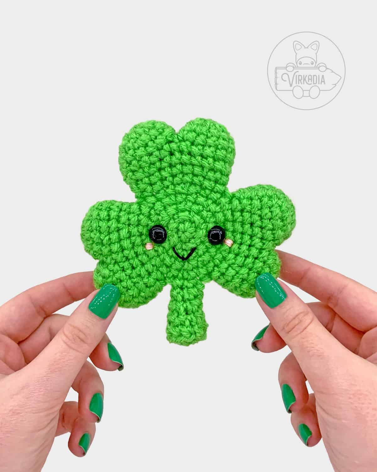 free crochet shamrock amigurumi pattern tutorial of where the face should be embroidered