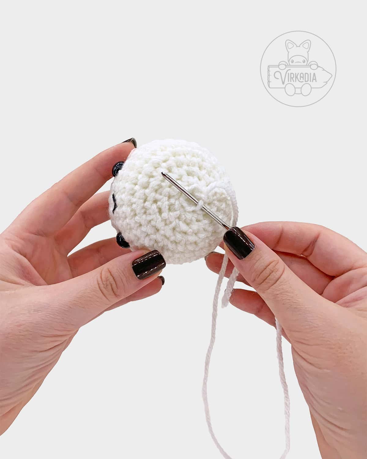 free amigurumi tutorial of how to sew the bottom of the marshmallow closed