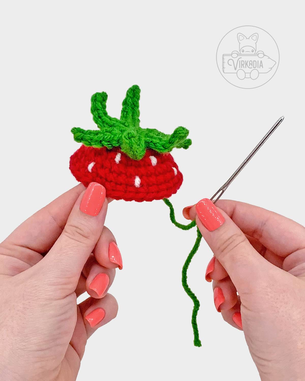 free amigurumi pattern tutorial of how to attach the leaves onto the fruit
