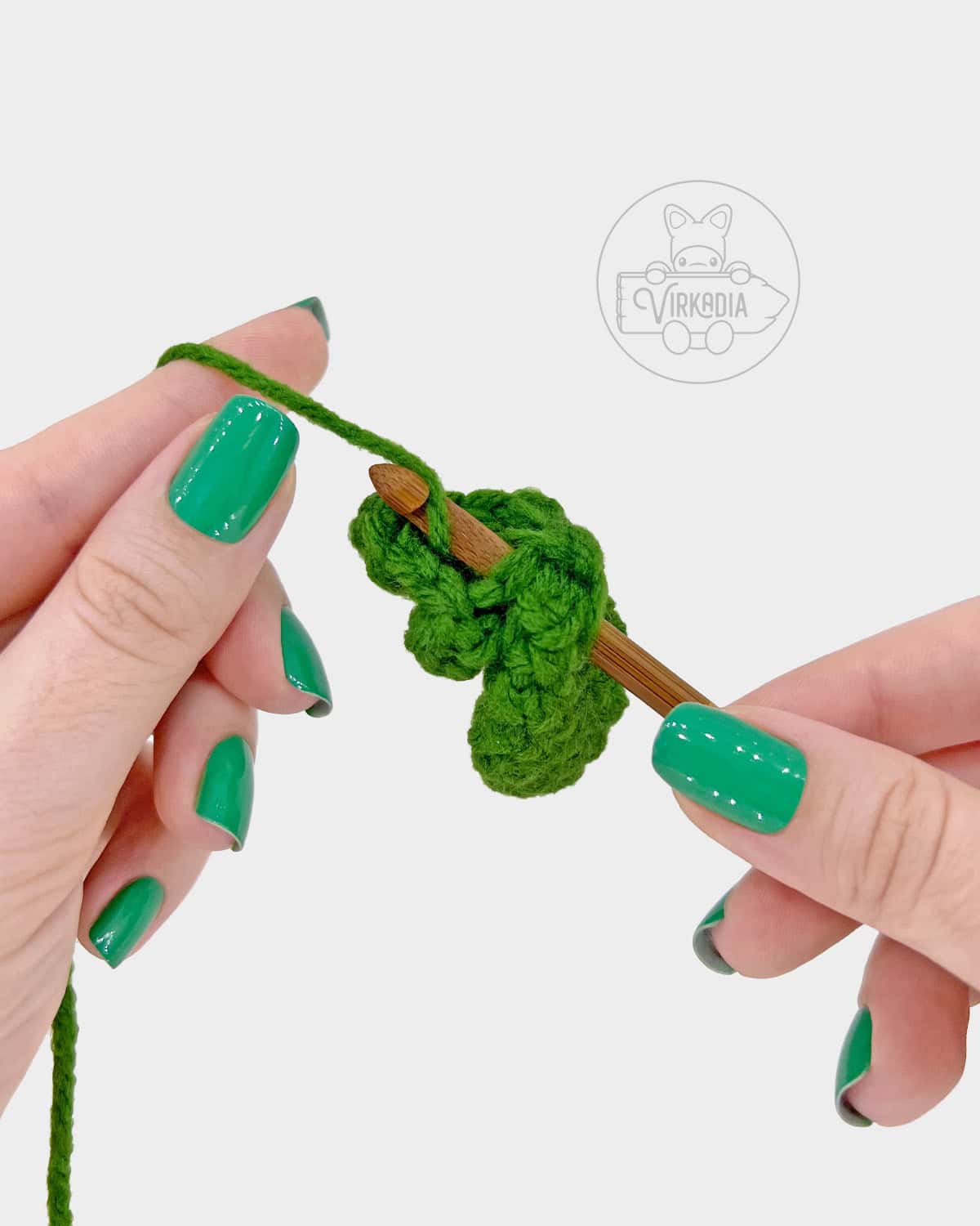 plant amigurumi pattern tutorial of how to attach a small leaf