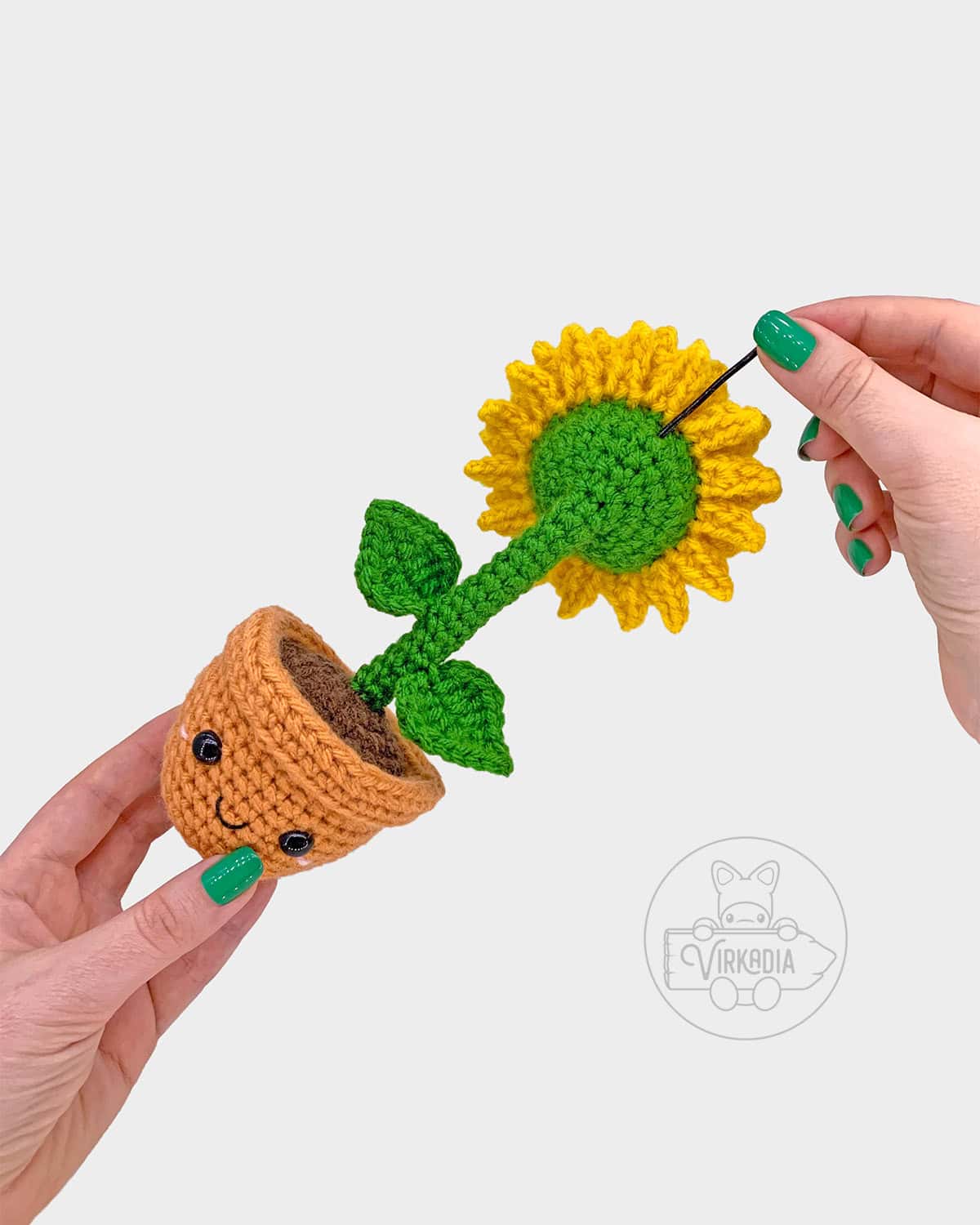 free crochet sunflower amigurumi pattern tutorial demonstration of how to add the wire into the flower