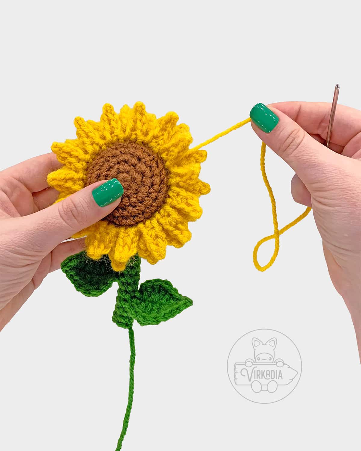 free crochet sunflower amigurumi pattern tutorial demonstration of how to sew the petals together