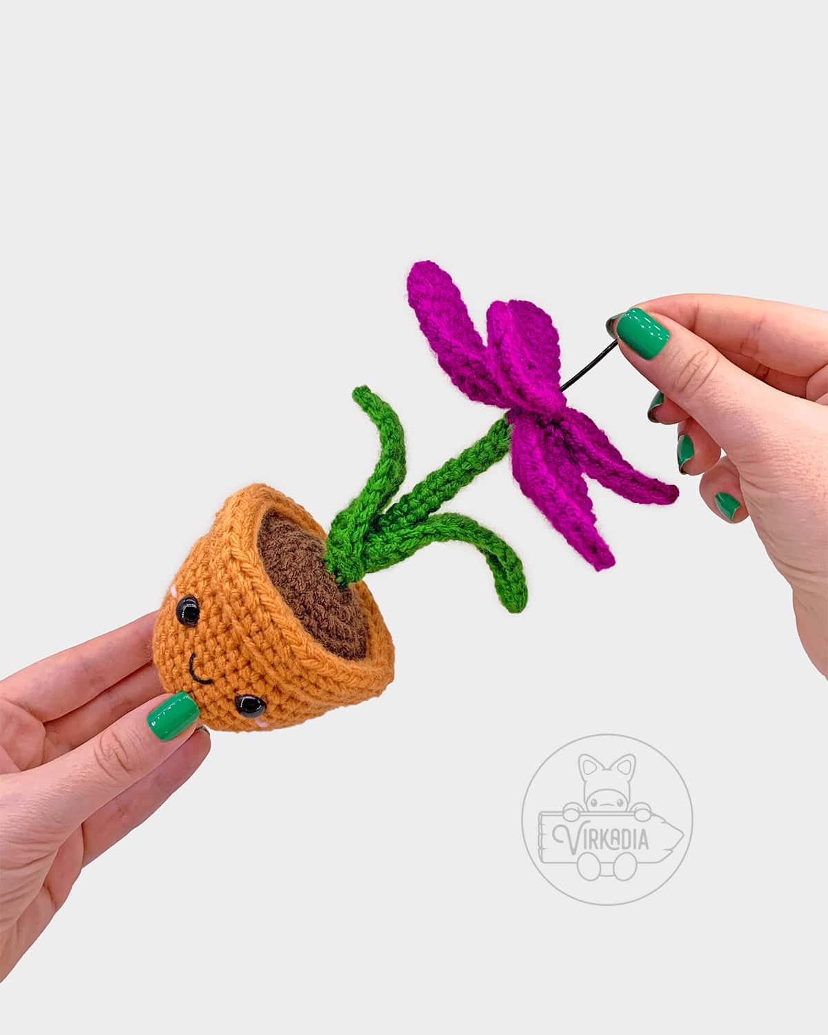 free crochet tulip amigurumi pattern tutorial demonstration of how to add the wire into the flower
