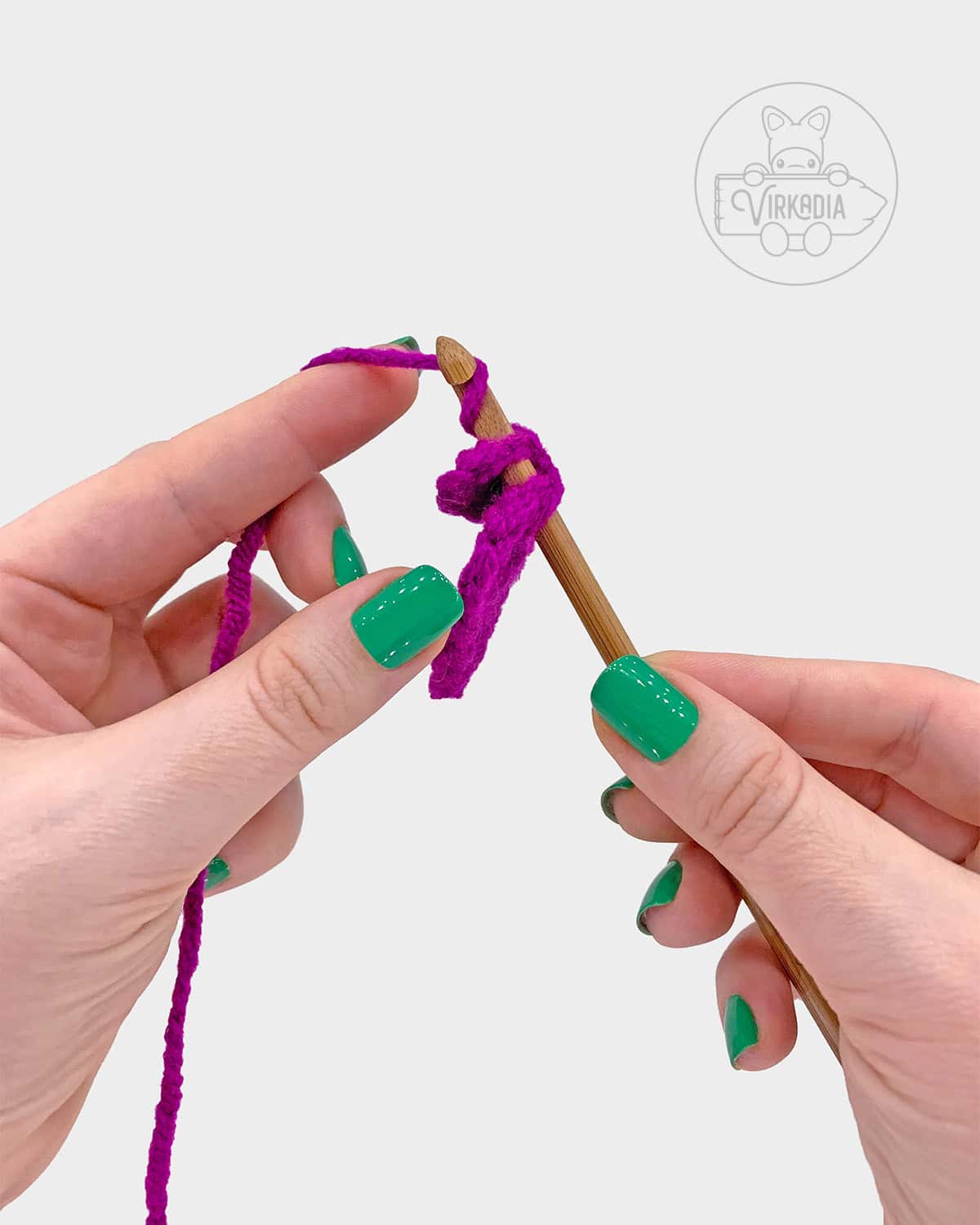 free crochet tulip amigurumi pattern tutorial demonstration of how to attach the petals