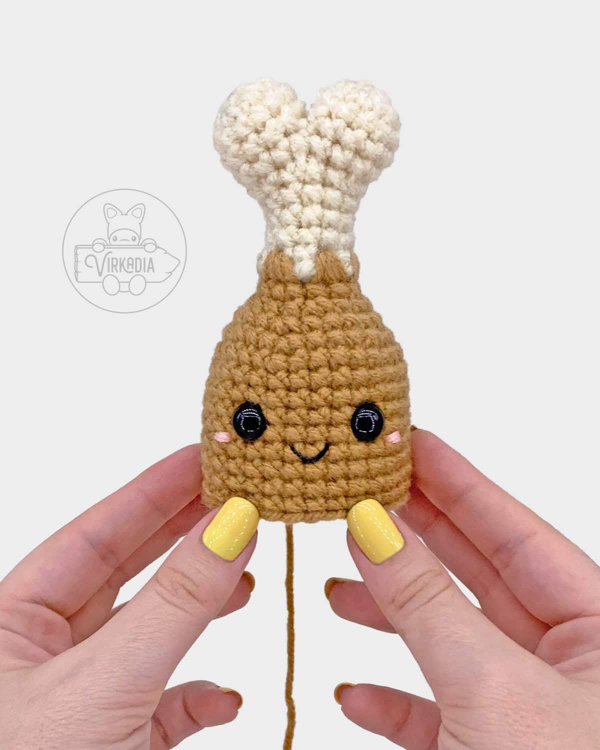 free crochet turkey leg amigurumi pattern tutorial of where to embroider the face on the meat
