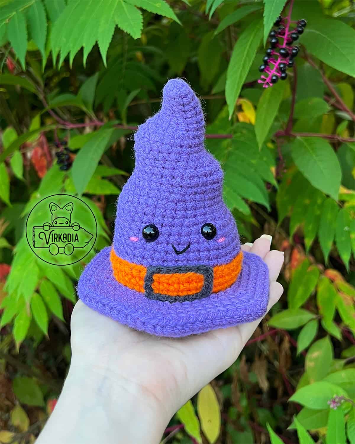candid shot of free crochet witch hat amigurumi plushie for Halloween decorations, spooky home decor, and fall crafts, and DIY gifts