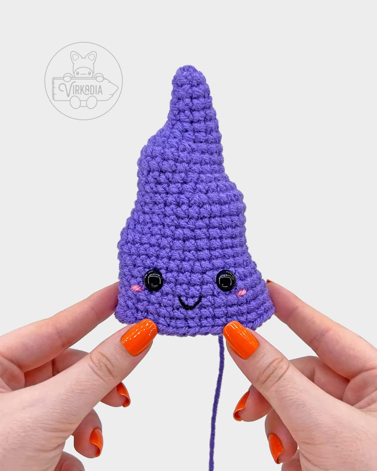 free crochet witch hat amigurumi tutorial of where the face should be embroidered